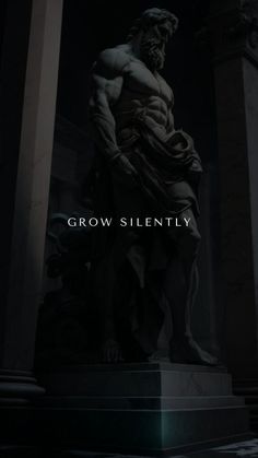 a statue with the words grow silently in front of it