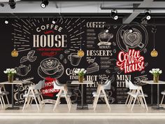 a coffee shop with chalkboard walls and chairs