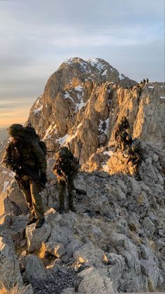 two men hiking up the side of a mountain