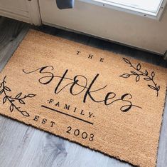 a door mat that says the strokes family best 2009 on it in front of a window