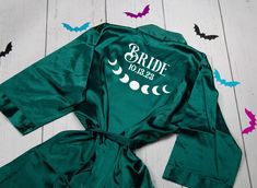 the bride robes are green and have bats on them