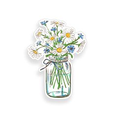 a mason jar filled with white and blue flowers