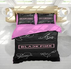 black pink and white bedding in a bedroom