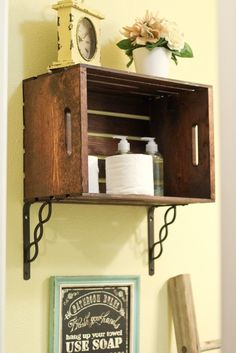 a shelf that has some toilet paper on top of it and a clock above it