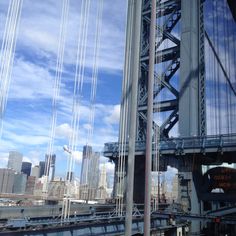 the bridge is very tall and has many cables