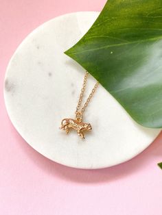 "♥ Tiger symbolism and meanings include strength, bravery, majesty and independence. This tiger charm necklace is great for casual outfits and daily wear. Perfect gift for a wild animal lover or a woman born in the year of the tiger (in 1974, 1986, 1998, 2010). 〔 𝐃 𝐞 𝐬 𝐜 𝐫 𝐢 𝐩 𝐭 𝐢 𝐨 𝐧 & 𝐒 𝐢 𝐳 𝐞 〕 24 karat light champagne gold plated over brass, high quality finish. Tiger charm - 11x18mm (~0.43x0.7\") ♥ Made in Europe - Riga, Latvia. Add matching tiger earrings from Kanelli Accessories: www.etsy.com/listing/1153065680 〔 𝐏 𝐚 𝐜 𝐤 𝐚 𝐠 𝐢 𝐧 𝐠 & 𝐒 𝐡 𝐢 𝐩 𝐩 𝐢 𝐧 𝐠 〕 It takes 1 to 2 days to prepare your order for shipping. All packages are shipped by local post service. Your jewelry will be packed in a cute paper or organza gift bag or you can upgrade your order with a From Mom To Daughter, Tiger Earrings, Tiger Necklace, Gold Tiger, Tiger Pendant, Lover Jewelry, Cute Birthday Gift, Necklace Dainty, Organza Gift Bags