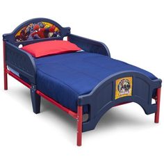 a child's bed with spiderman on it