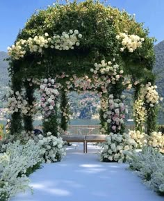 an outdoor ceremony with white and pink flowers