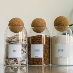 three jars filled with different types of spices