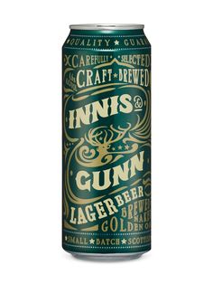 a can of beer that is green and has gold lettering on the bottom half of it