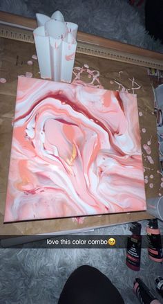 the painting is being worked on by someone who has done it in pink and white