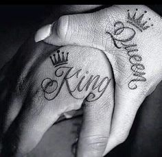 two hands holding each other with the word king and queen written on them, both