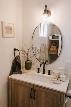 a bathroom sink with a mirror above it