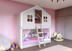 a child's bedroom with a pink and white bunk bed, wooden flooring and walls