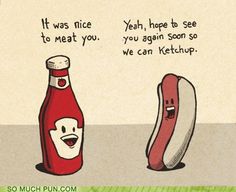 a hot dog and ketchup bottle sitting next to each other