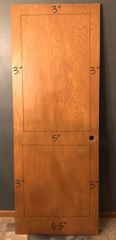 a wooden cabinet with measurements on it