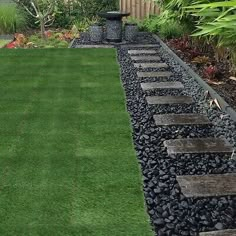 a garden with stepping stones in the grass