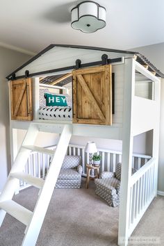 there is a loft bed with wooden shutters on the top and stairs to the bottom