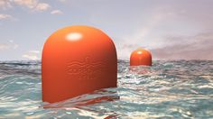 two orange buoys floating in the ocean on top of each other with water around them