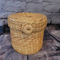 a wicker basket sitting on top of a wooden table