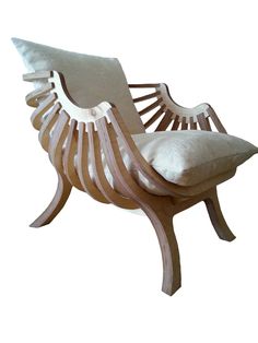 a wooden chair with a white pillow on it's back and armrests