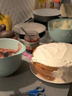 the cake is ready to be cut and served on the kitchen counter with utensils