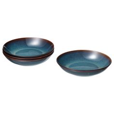 two blue bowls sitting next to each other