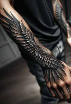 a man's arm with wings on it