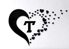 the letter t is surrounded by hearts in black on a white background with an arrow