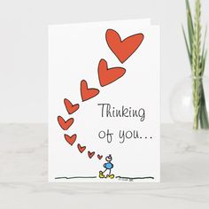 a card that says thinking of you with hearts