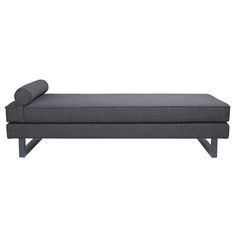 a gray couch sitting on top of a wooden frame