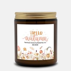 a jar of honey with the words hello autumn on it and an image of flowers