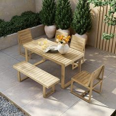 a wooden table and chairs on a patio