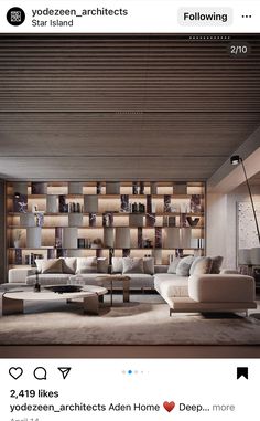 a living room with lots of white furniture and wooden shelves on the wall behind it