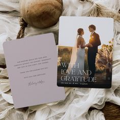 two cards that are next to each other on some fabric and cloth with an image of a bride and groom