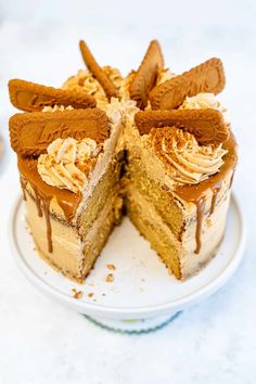 a cake that has been cut in half on a white plate with one slice missing