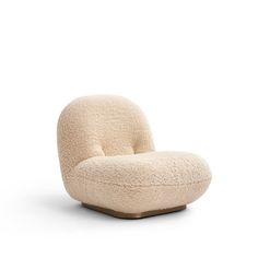 the chair is made out of sheep's wool and has a rounded backrest