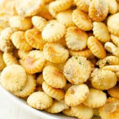 a white bowl filled with crackers on top of a table