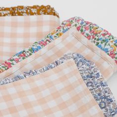 four pieces of cloth with different patterns on them