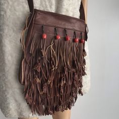 "Cute brown leather handbag, leather in good condition, leather soft,clean, no smell, without defect, the bag has a simple style-one large compartment, behind there is 1 patch pocket, the bag with a long fringe and tassels made of leather, the bag is decorated with large and small beads, bag with zipper, zipper works well, the bag has a long handle, handbag with lining, lining - clean, no smell, casual style bag, the handbag is stylish, ideal for jeans and dresses of any length, looks great with Leather Hobo Bag With Tassels For Everyday, Leather Satchel With Fringe For Travel, Leather Travel Shoulder Bag With Tassels, Brown Hobo Bag With Tassels For Travel, Leather Hobo Bag With Tassels In Tote Shape, Leather Travel Bag With Tassels, Travel Hobo Bag With Fringe In Brown, Leather Hobo Bag With Tassels, Leather Hobo Bag With Tassels In Crossbody Style