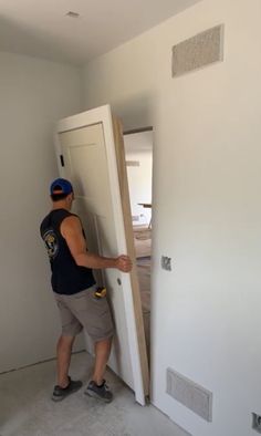 a man is opening the door to his new house