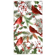 a towel with red birds on it and pine cones, holly branches, and berries