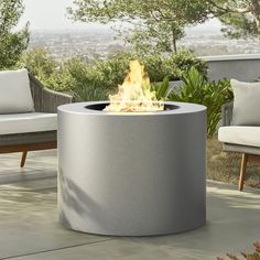 a fire pit sitting on top of a patio