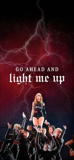 a poster with the words go ahead and light me up in front of a group of dancers