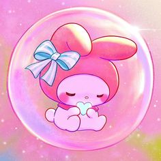 a pink bunny with a bow sitting in a bubble