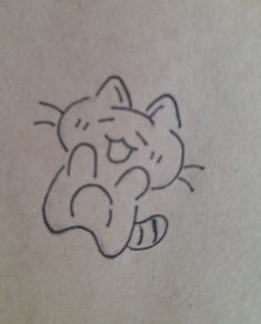 a small drawing of a cat on the back of a woman's stomach,