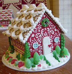 a gingerbread house decorated with icing and decorations