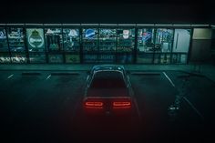 a car parked in a parking lot at night