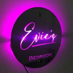 a neon sign that says service bedroom on the side of a wall with purple lighting