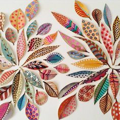 an artistic paper art work with colorful leaves